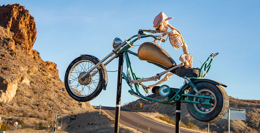 Skeleton on motorcycle.